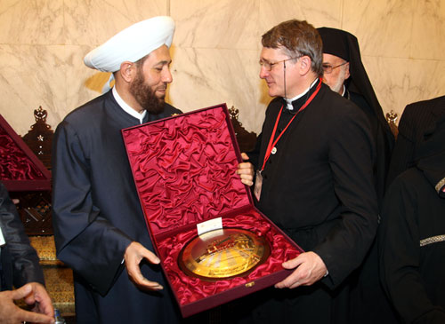 Receiving a gift from Dr Hassoun, the Grand Mufti of Syria