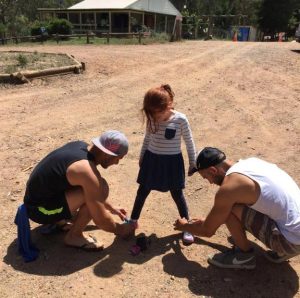 Two weekend warriors pause to tie Fran's shoes